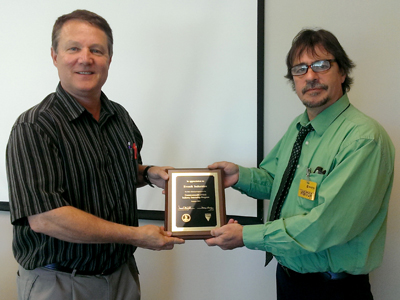 Scott Bellows (right) presented the CSIIP plaque to Tom Baker of Evonik Industries in Hopewell. Evonik hired interns who majored in Chemical Engineering, Mechanical Engineering, Environmental Engineering, and Chemistry.